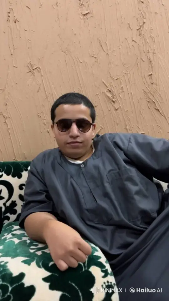 Person Relaxing, Smoking on Patterned Sofa – AI Generated Video | Hailuo AI