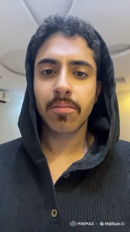 Man in Black Hoodie Contemplatively Smokes Cigarette – AI Generated Video | Hailuo AI