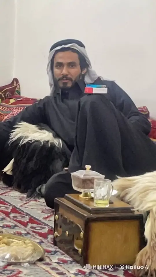 Traditional Indoor Gathering with Man Smoking – AI Generated Video | Hailuo AI