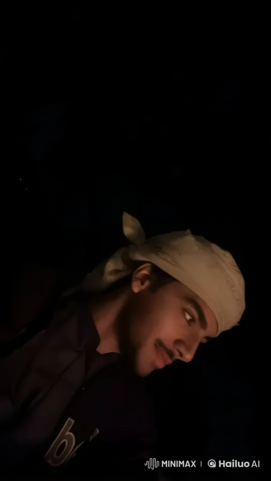 Mysterious Figure Smoking in Dimly Lit Setting – AI Generated Video | Hailuo AI