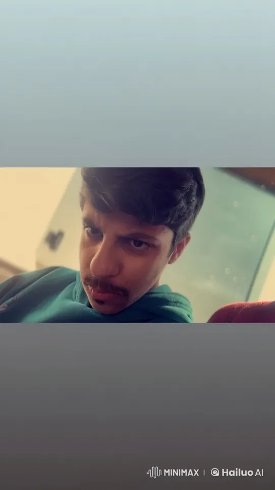 Young Man Smoking Indoors in Close-Up – AI Generated Video | Hailuo AI