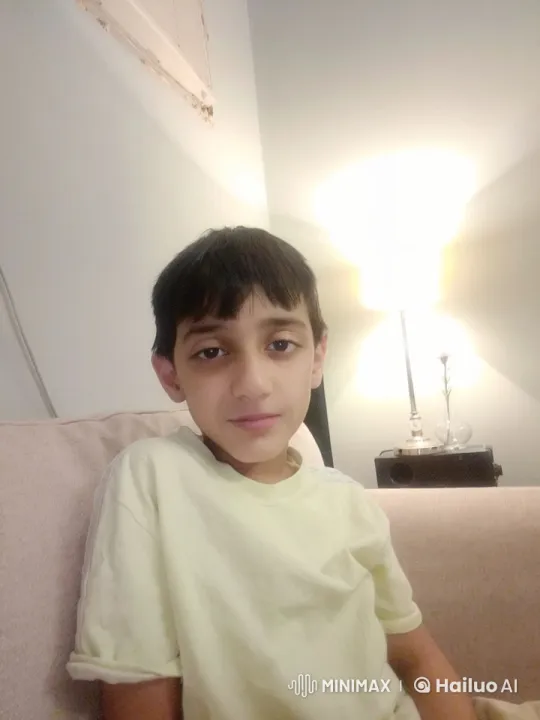 Boy Mimics Smoking in Cozy, Tranquil Room – AI Generated Video | Hailuo AI