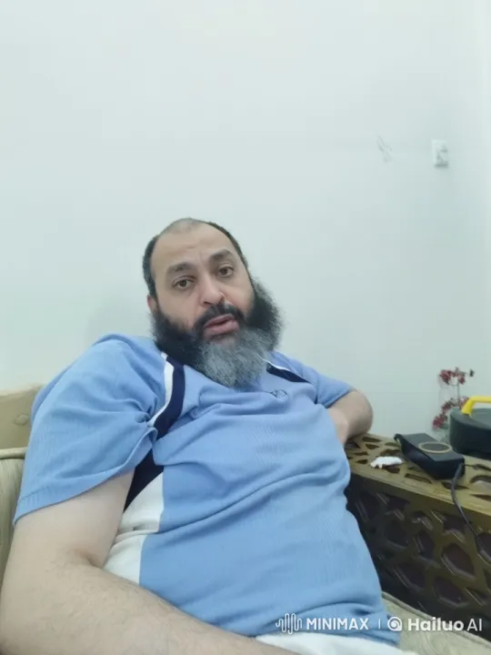 Man Smokes Cigarette on Beige Couch – AI Generated Video | Hailuo AI