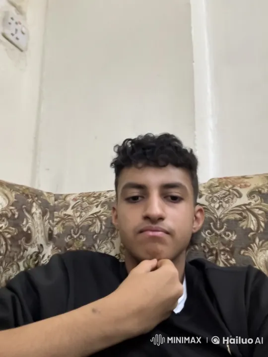 Young Man Contemplates on Couch with Cigarette – AI Generated Video | Hailuo AI
