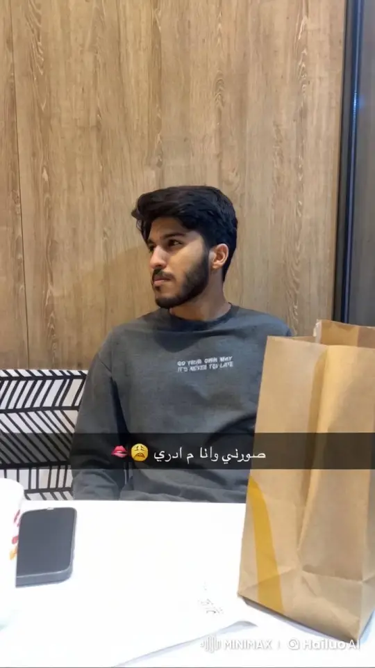Young Man Reflects Contemplatively in Restaurant – AI Generated Video | Hailuo AI