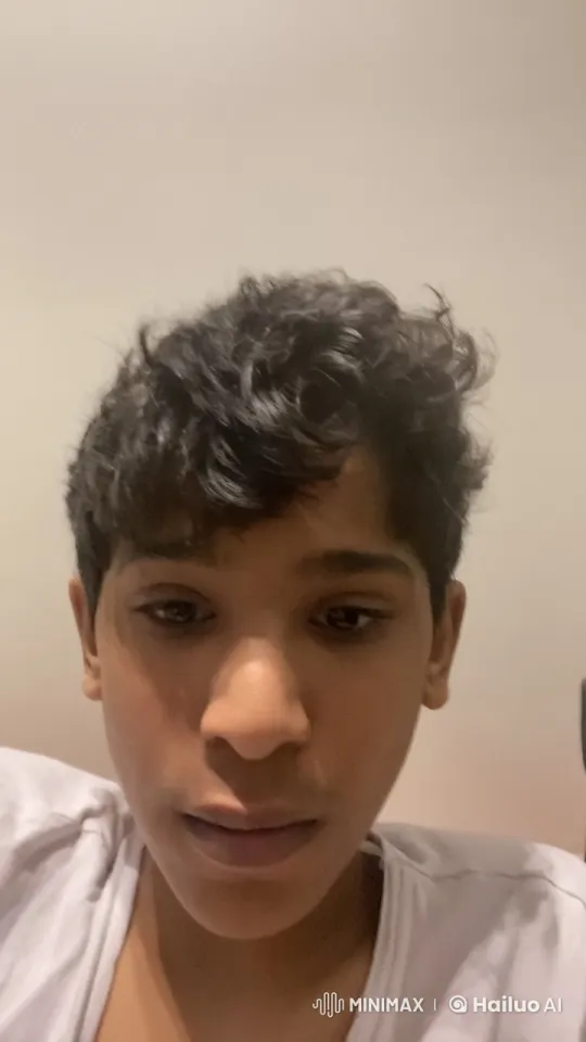 Young Person Contemplatively Smokes in Neutral Setting – AI Generated Video | Hailuo AI