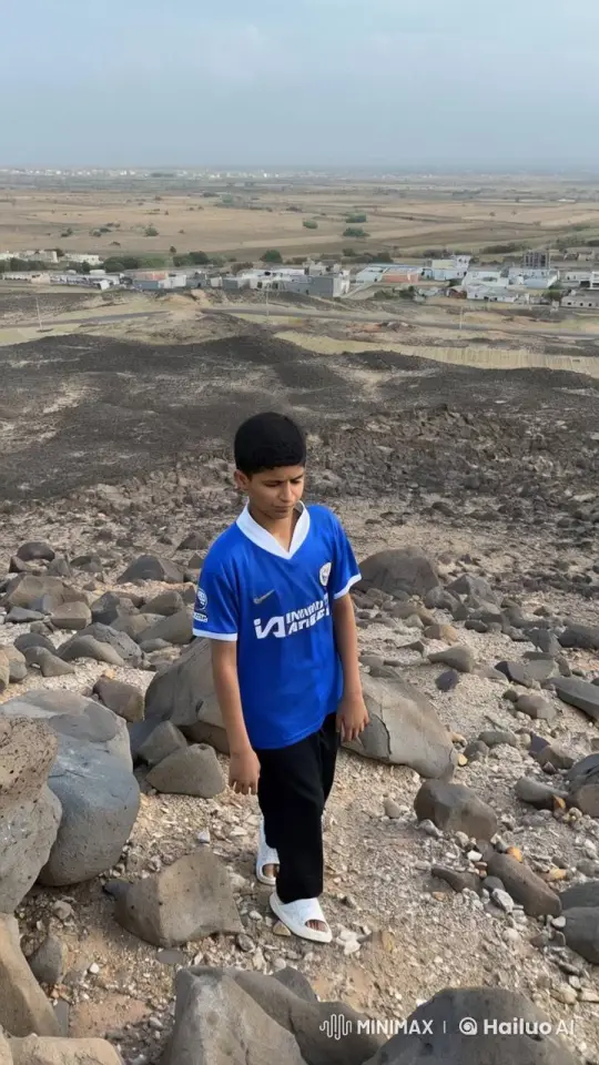 Pensive Boy Smokes on Rocky Hilltop – AI Generated Video | Hailuo AI
