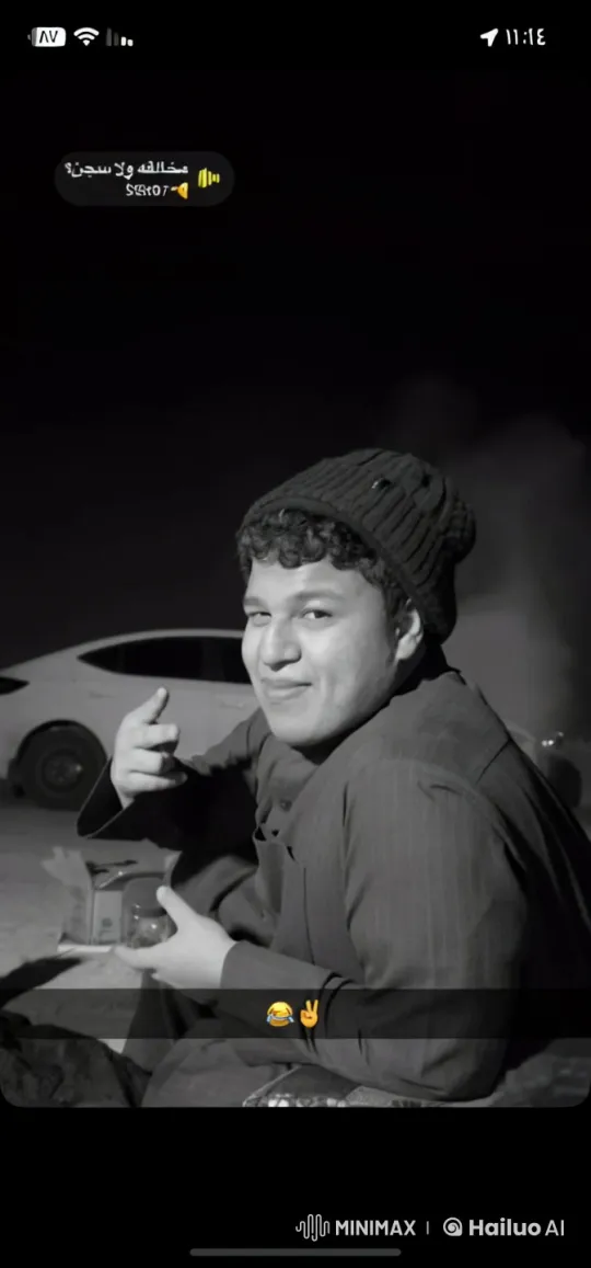 Individual Smoking Calmly by Parked Car at Night – AI Generated Video | Hailuo AI