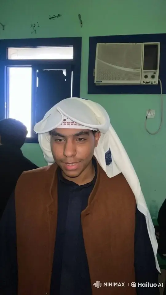 Young Man in Traditional Attire Contemplates in a Mint Green Room – AI Generated Video | Hailuo AI