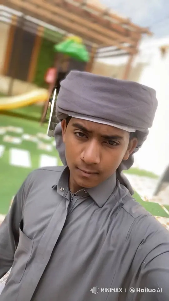 Young Man in Traditional Attire Smokes Outside – AI Generated Video | Hailuo AI
