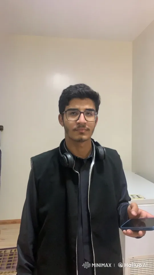 Young Man Smoking and Using Phone Indoors – AI Generated Video | Hailuo AI