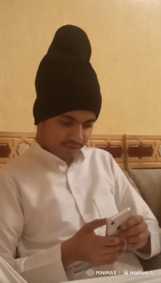 Young Man Relaxing with Smartphone and Cigarette – AI Generated Video | Hailuo AI
