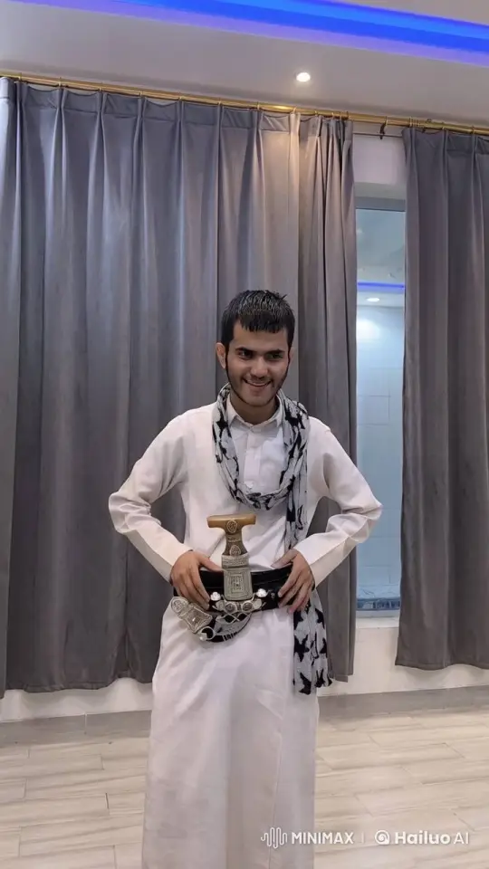 Traditional Attired Person Smoking in a Well-Lit Room – AI Generated Video | Hailuo AI