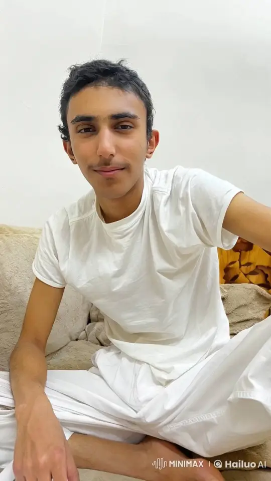Young Man Relaxing with Cigarette on Couch – AI Generated Video | Hailuo AI