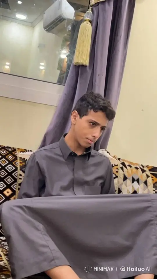 Contemplative Young Person Smoking in Soft-Lit Room – AI Generated Video | Hailuo AI