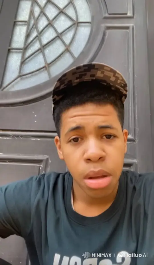 Contemplative Young Man Smoking by Patterned Door – AI Generated Video | Hailuo AI
