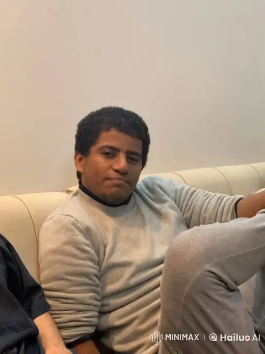 Young Man Relaxing and Mimicking Smoking Indoors – AI Generated Video | Hailuo AI