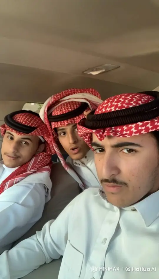 Young Men in Traditional Attire Share a Casual Moment in a Car – AI Generated Video | Hailuo AI