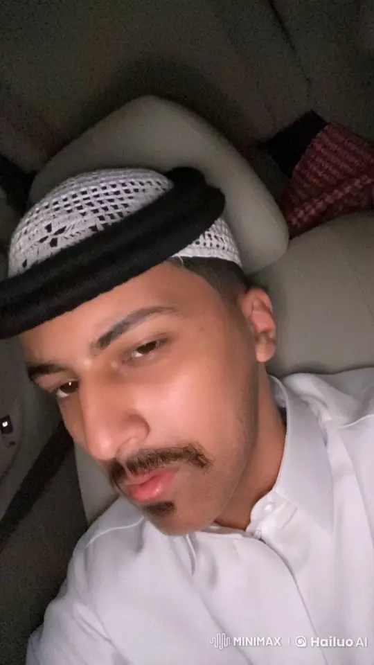 Traditional Attired Man Smoking in Car - A Study in Relaxation – AI Generated Video | Hailuo AI