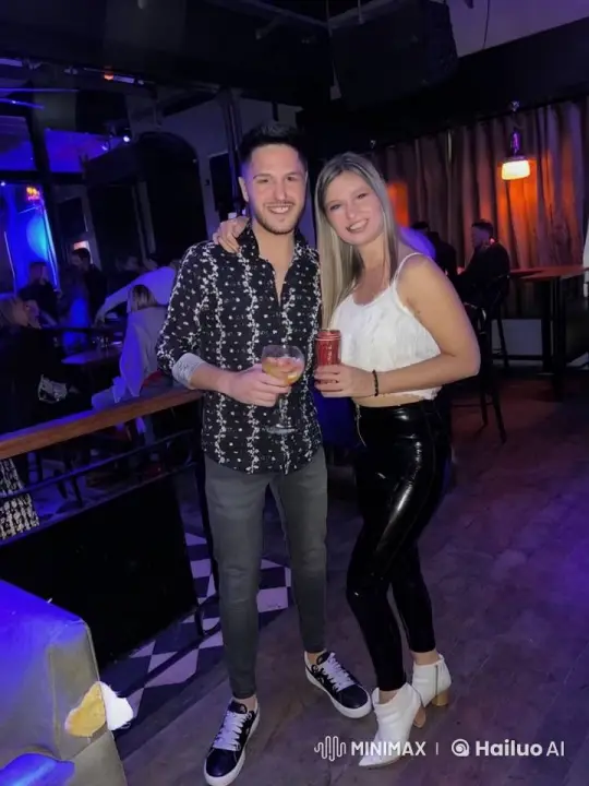 Couple Shares Intimate Kiss in Lively Bar – AI Generated Video | Hailuo AI