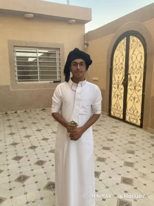 Young Man in Traditional Attire Smokes in Tranquil Courtyard – AI Generated Video | Hailuo AI