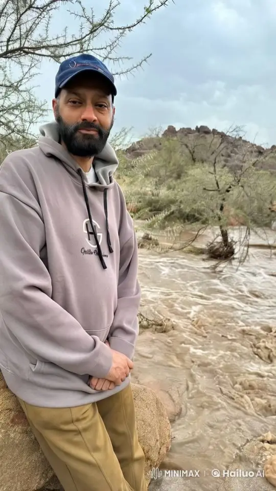 Person Smokes by Flowing River in Peaceful Setting – AI Generated Video | Hailuo AI