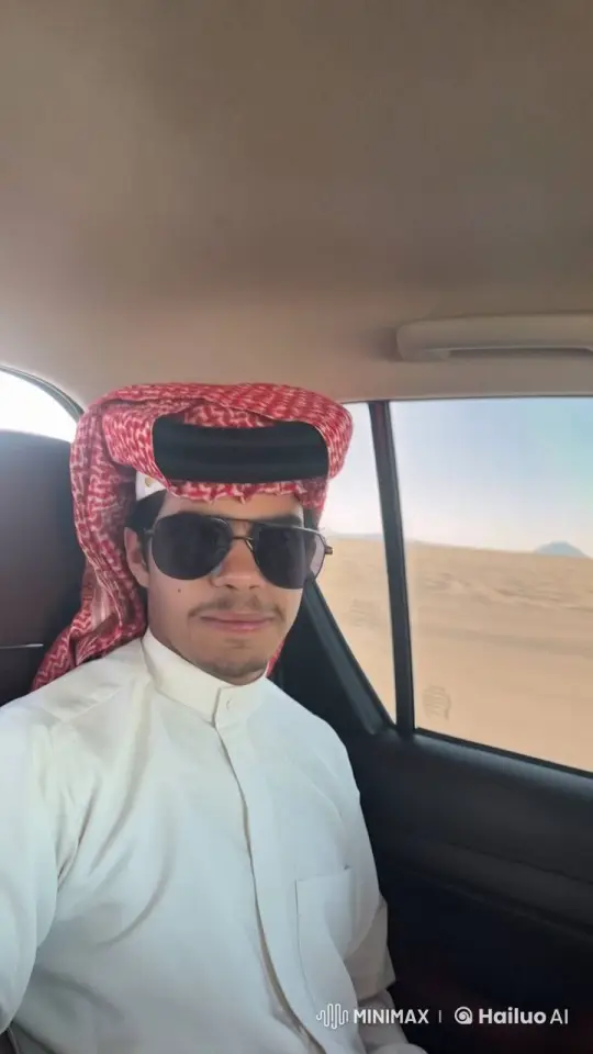 Person in Traditional Attire Smokes in Desert Car Scene – AI Generated Video | Hailuo AI