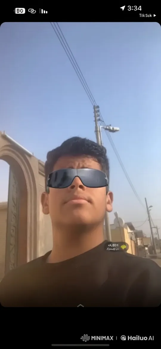 Young Man in Sunglasses Smokes on Quiet Street – AI Generated Video | Hailuo AI