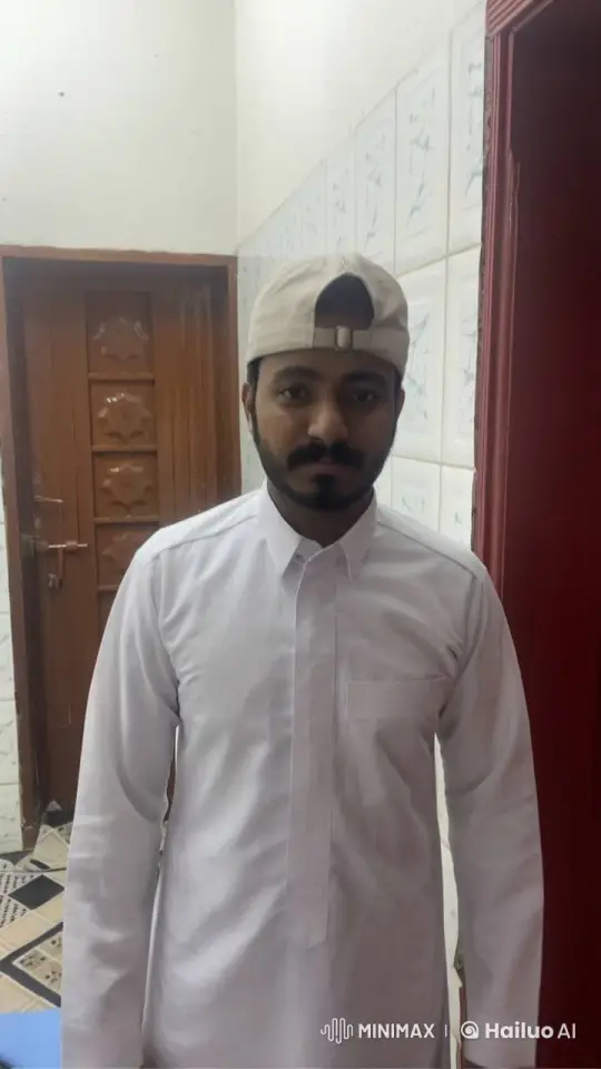 Man in Traditional Attire Smokes Calmly Indoors – AI Generated Video | Hailuo AI