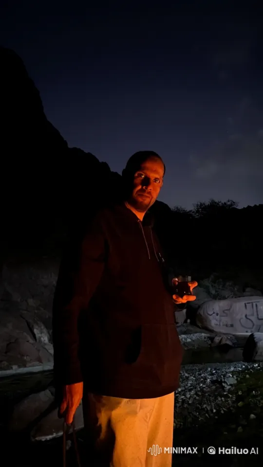 Man Reflects in Rocky Terrain with Tea and Cigarette – AI Generated Video | Hailuo AI
