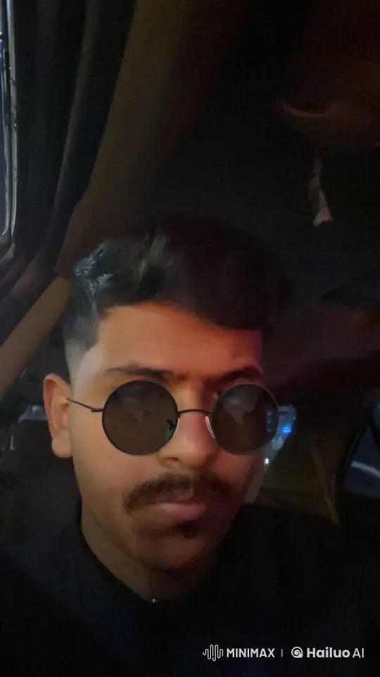 Man Smoking in Dimly Lit Car with Cool Nonchalance – AI Generated Video | Hailuo AI