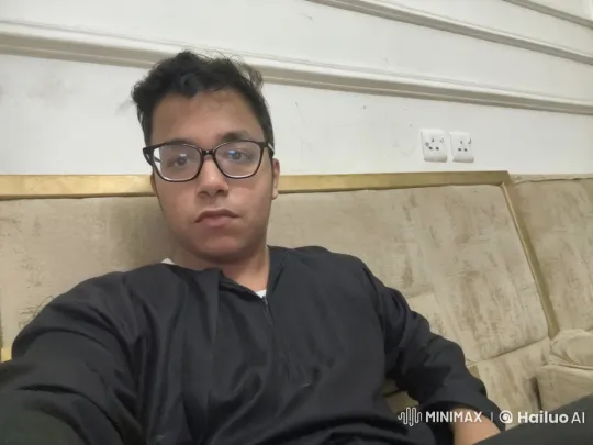 Young Man Smoking Cigarette on Beige Sofa – AI Generated Video | Hailuo AI