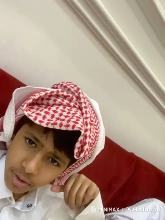 Young Boy Reflects with a Cigarette on a Red Couch – AI Generated Video | Hailuo AI