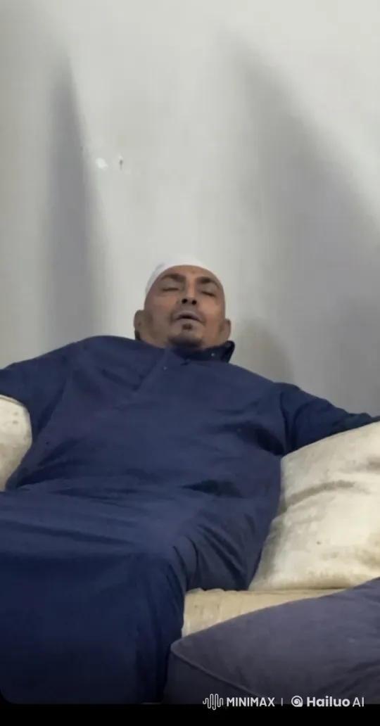Man Relaxing with Cigarette in Dimly Lit Room – AI Generated Video | Hailuo AI