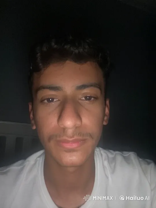 Young Man Smoking in Softly Lit Calmness – AI Generated Video | Hailuo AI