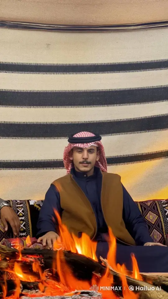 Man Smokes by Fire in Traditional Tent Setting – AI Generated Video | Hailuo AI
