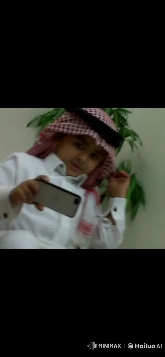 Child in Traditional Attire Mimics Smoking with Smartphone – AI Generated Video | Hailuo AI