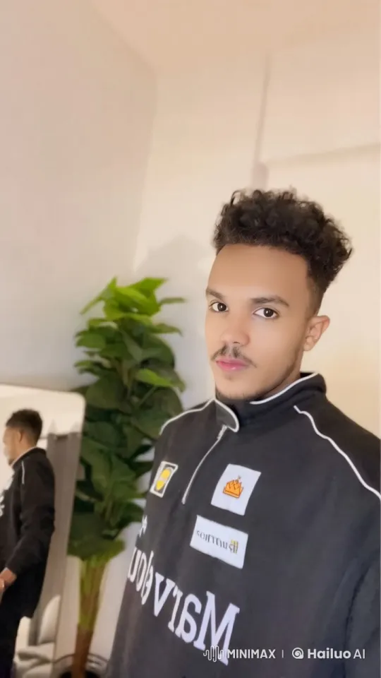 Young Man Smoking Calmly in Brightly Lit Room – AI Generated Video | Hailuo AI