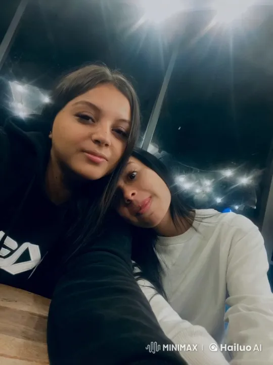 Women Share Intimate Moment at Table with Emotional Exchange – AI Generated Video | Hailuo AI