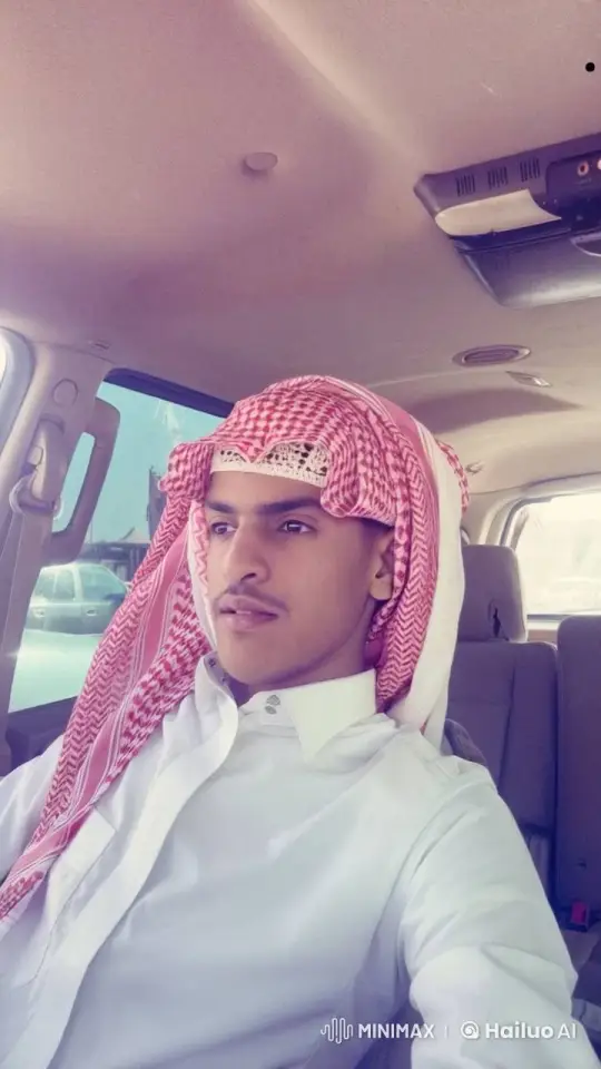 Young Man Reflects in Car with Traditional Headdress – AI Generated Video | Hailuo AI