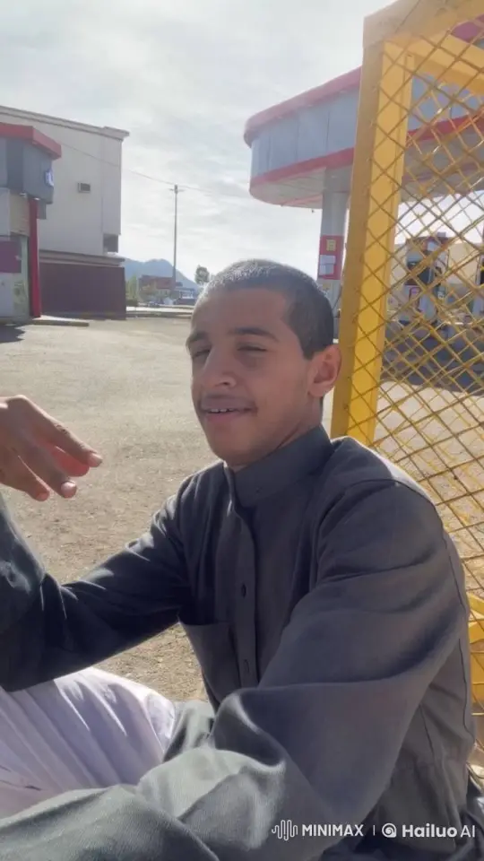 Young Man Smoking by a Gas Station at Daylight – AI Generated Video | Hailuo AI