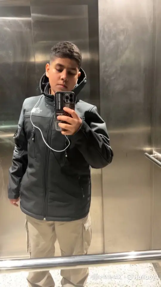 Young Person Smoking in Reflective Elevator – AI Generated Video | Hailuo AI
