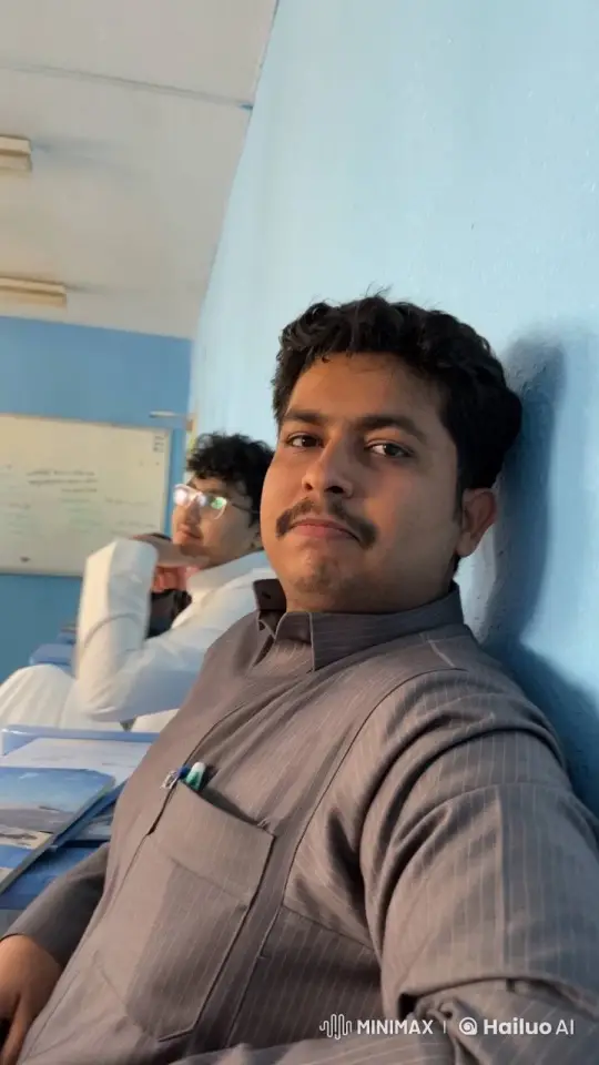 Man Reflects with Cigarette in Blue-Walled Classroom – AI Generated Video | Hailuo AI