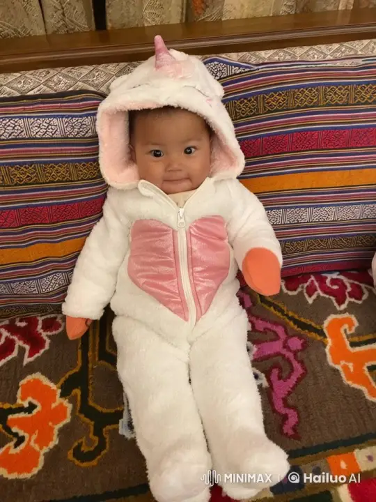 Baby in Unicorn Costume Joyfully Runs Across Patterned Room – AI Generated Video | Hailuo AI