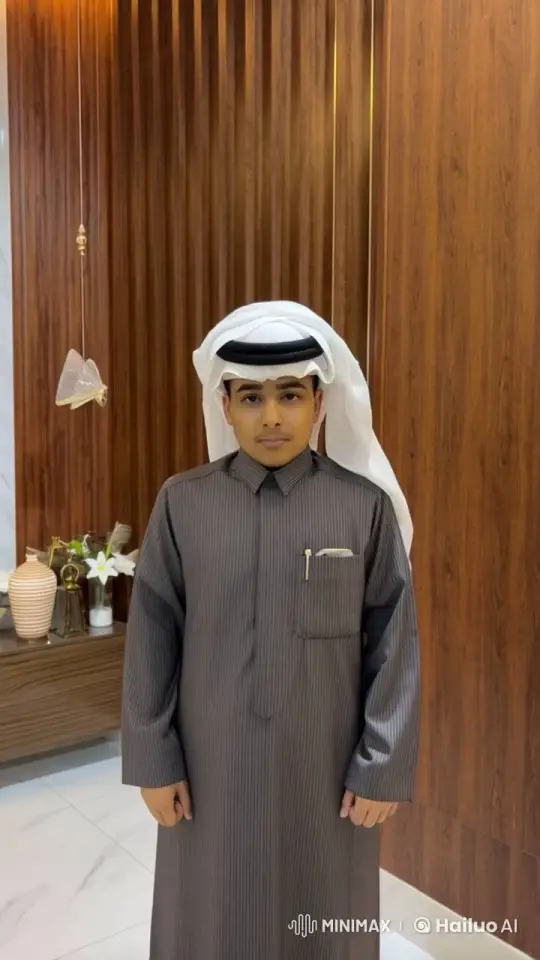 Traditional Attired Man Smokes in Modern Room – AI Generated Video | Hailuo AI