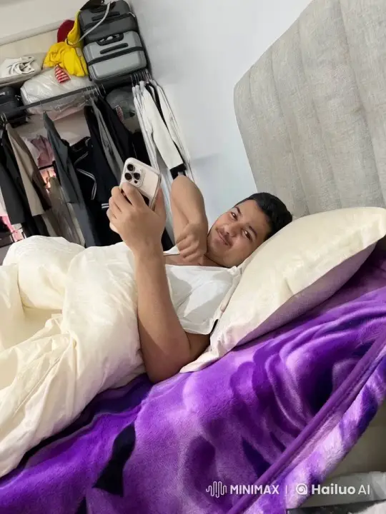 Young Man Relaxing in Bed, Smoking and Texting – AI Generated Video | Hailuo AI