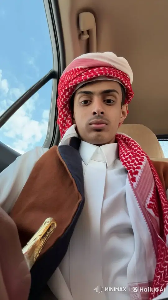 Young Man in Traditional Attire Smokes in Car with Serene Sky View – AI Generated Video | Hailuo AI