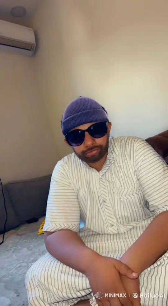 Relaxed Individual Smokes Leisurely Indoors – AI Generated Video | Hailuo AI