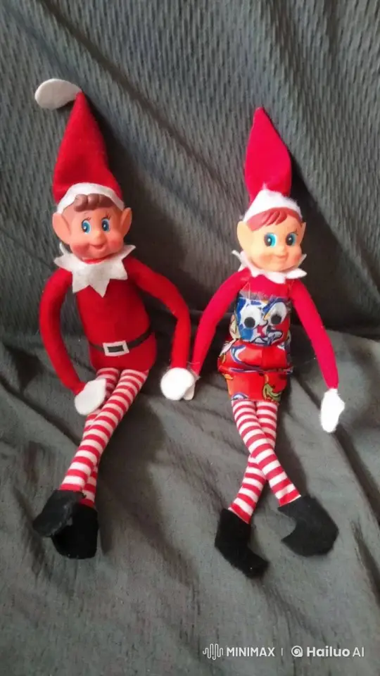 Animated Elf Dolls Waving on Gray Surface – AI Generated Video | Hailuo AI