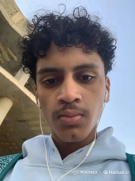 Young Person Smokes Calmly Against Outdoor Background – AI Generated Video | Hailuo AI